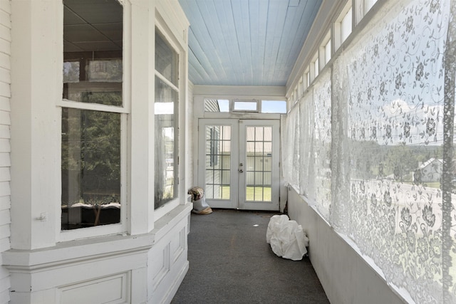 sunroom / solarium featuring french doors