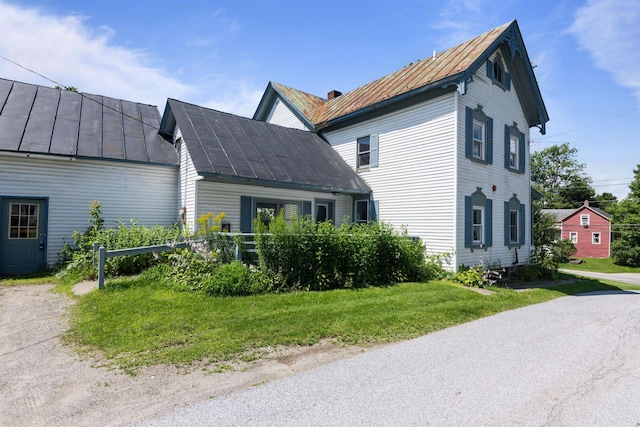 view of home's exterior featuring a lawn