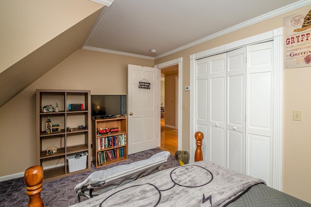 bedroom with hardwood / wood-style floors, vaulted ceiling, ornamental molding, and a closet