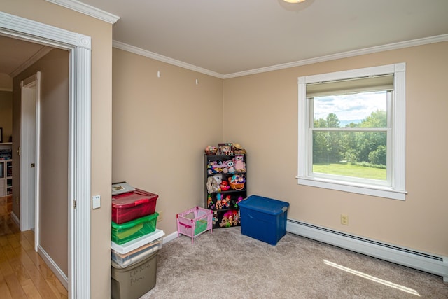 game room with a baseboard radiator, light colored carpet, and crown molding