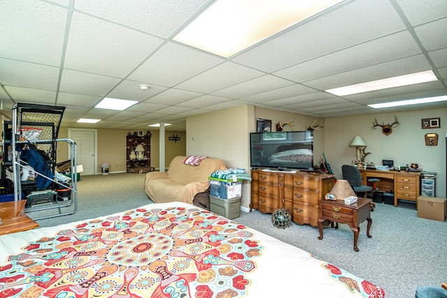 bedroom with carpet and a drop ceiling