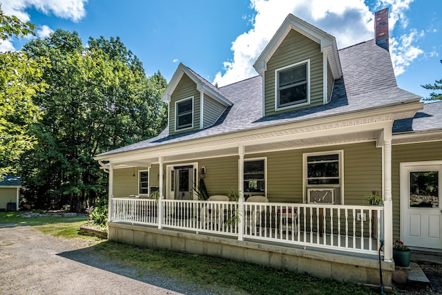 cape cod home with a porch