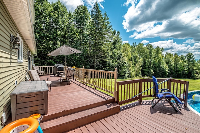 wooden terrace with a lawn