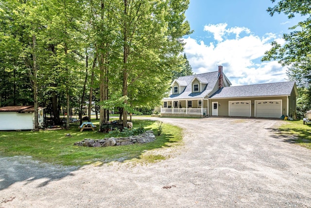 view of front of home with a garage and covered porch