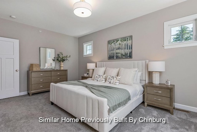 bedroom featuring light colored carpet