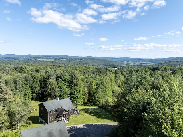 bird's eye view featuring a mountain view and a wooded view