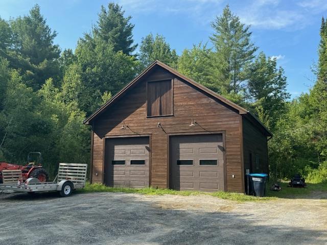 detached garage featuring driveway