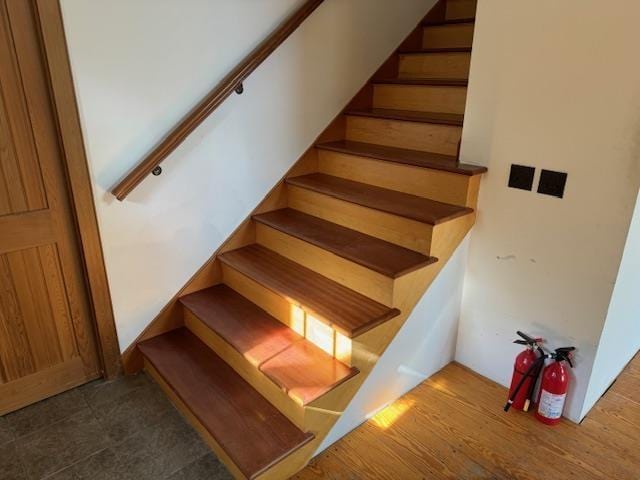 staircase featuring wood finished floors