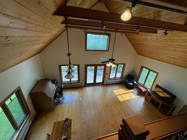 additional living space with wood ceiling, high vaulted ceiling, hardwood / wood-style floors, and beamed ceiling