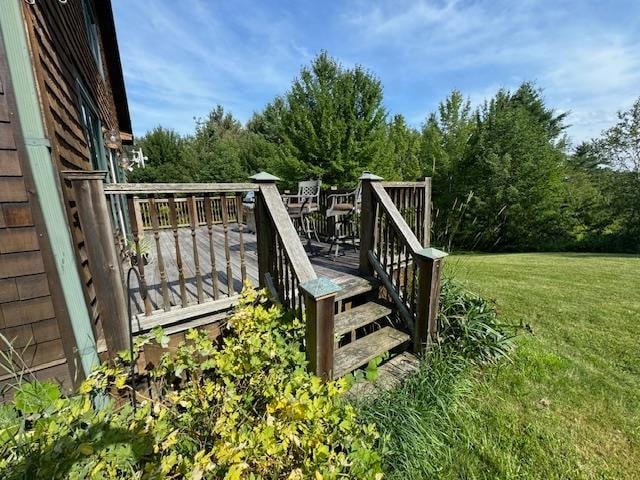 deck featuring a lawn