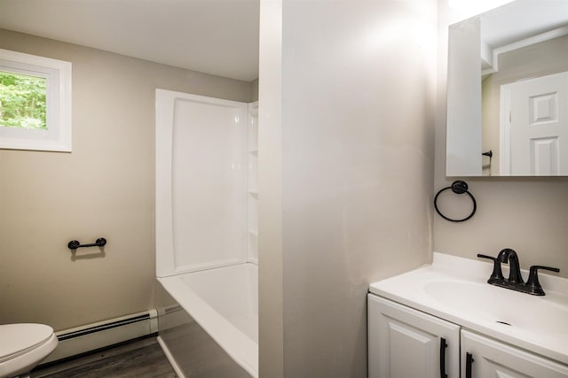 full bathroom featuring shower / tub combination, a baseboard radiator, hardwood / wood-style flooring, vanity, and toilet