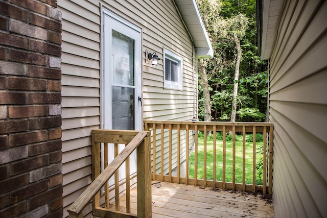 wooden deck with a yard