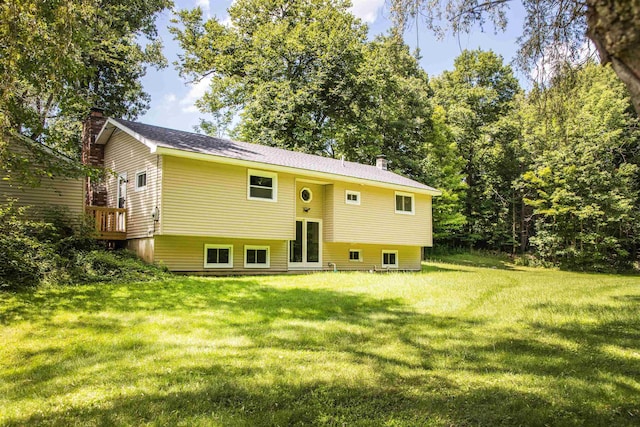 back of house featuring a yard