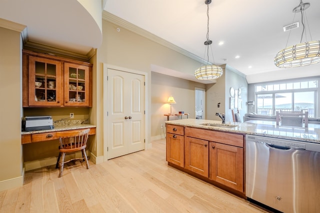 kitchen with built in desk, visible vents, brown cabinetry, a sink, and dishwasher