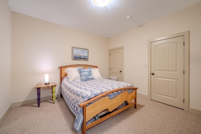 carpeted bedroom with baseboards