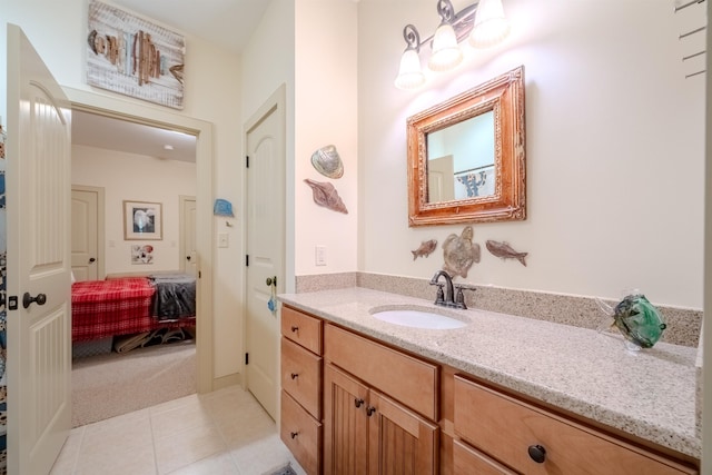 ensuite bathroom featuring ensuite bath, vanity, and tile patterned floors