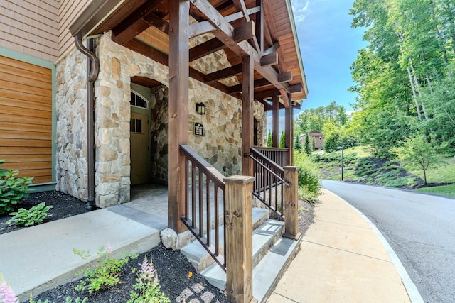 doorway to property featuring stone siding