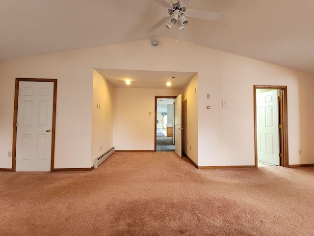 carpeted spare room featuring baseboard heating, ceiling fan, and vaulted ceiling