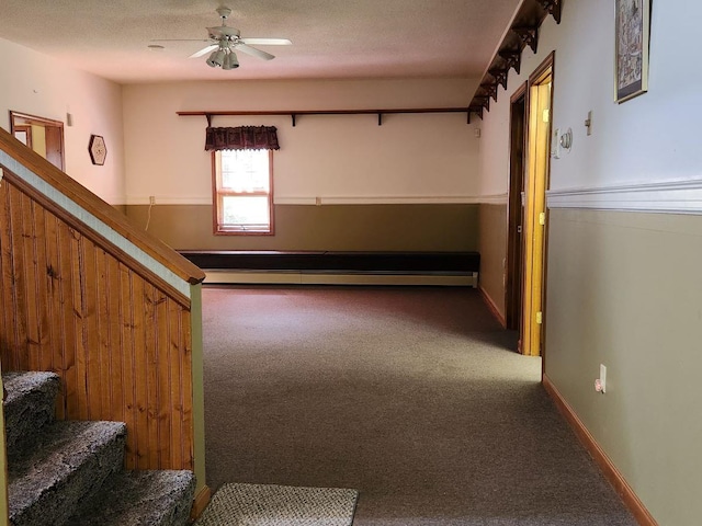 interior space featuring ceiling fan and a textured ceiling