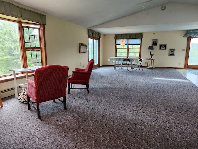 carpeted dining space with vaulted ceiling and a wall mounted air conditioner