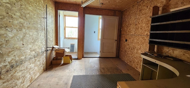 doorway with hardwood / wood-style floors