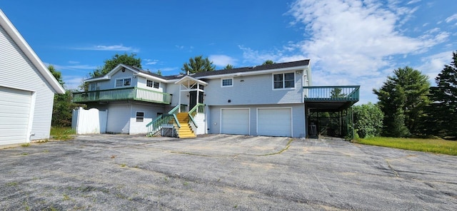 view of front facade with a deck and a garage