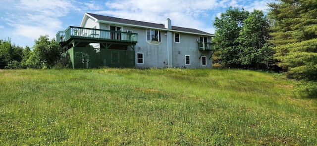 rear view of property featuring a deck