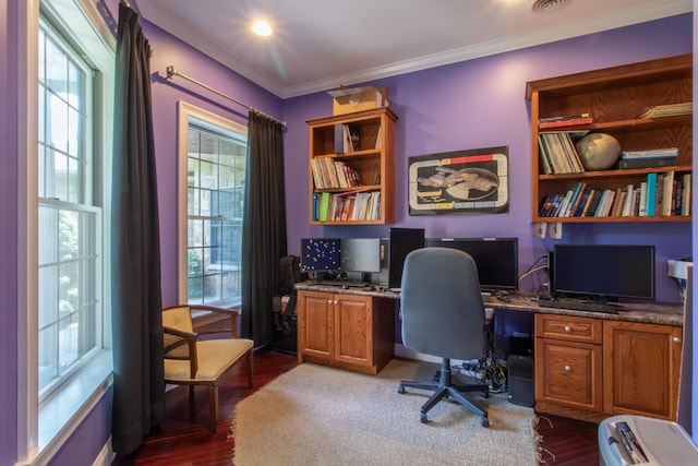 office featuring crown molding, built in desk, and dark hardwood / wood-style flooring