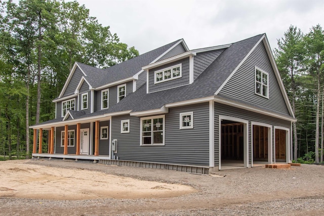 view of front of house with a garage and a porch