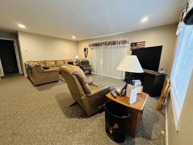 living room with recessed lighting and carpet