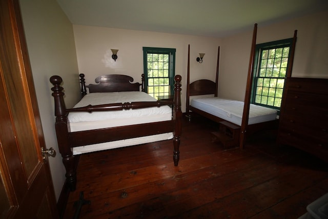 bedroom with hardwood / wood-style flooring
