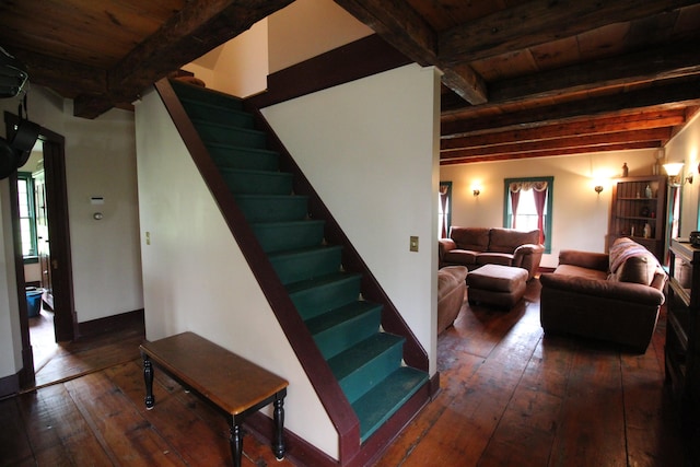 staircase featuring wood ceiling, hardwood / wood-style floors, and beamed ceiling