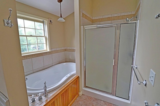 bathroom featuring plus walk in shower and tile patterned floors