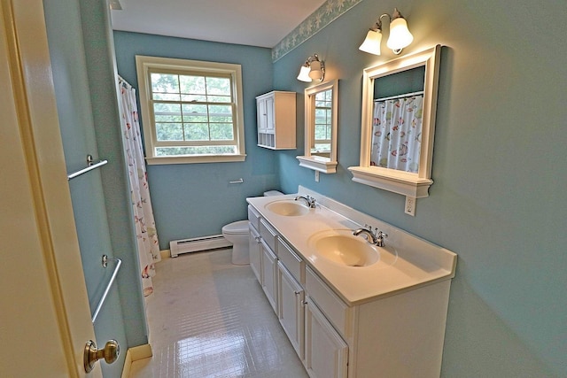 bathroom with a baseboard radiator, vanity, and toilet