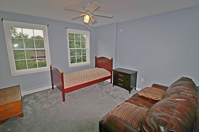 bedroom featuring carpet floors, a baseboard heating unit, and ceiling fan