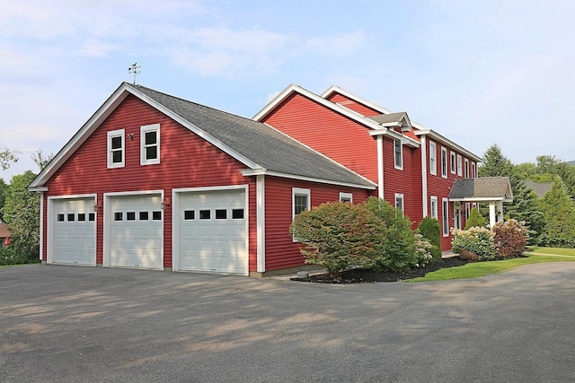 view of side of property featuring a garage