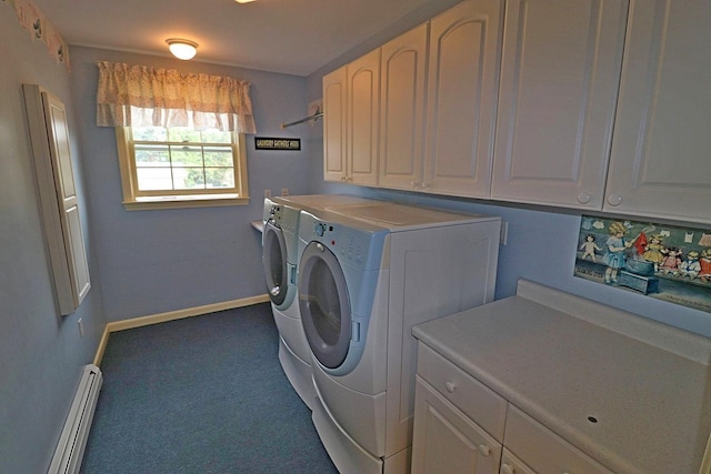 washroom featuring cabinets, a baseboard radiator, and washer and dryer