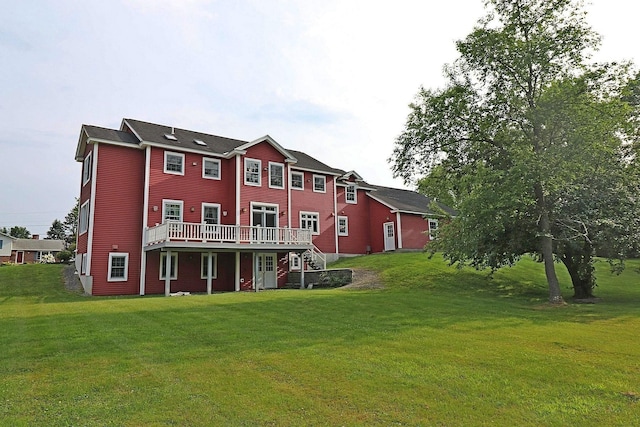 back of house featuring a yard and a deck