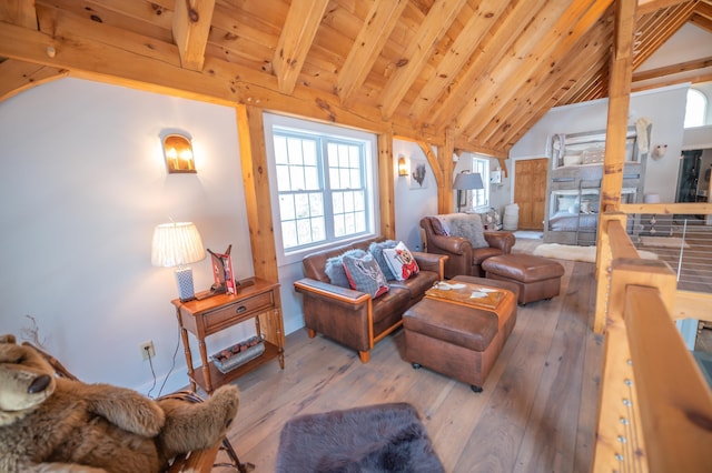 living room with beamed ceiling, high vaulted ceiling, hardwood / wood-style flooring, and wood ceiling