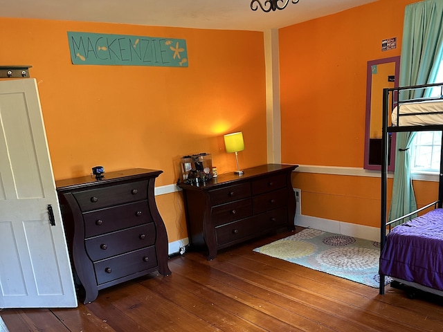 bedroom with hardwood / wood-style flooring