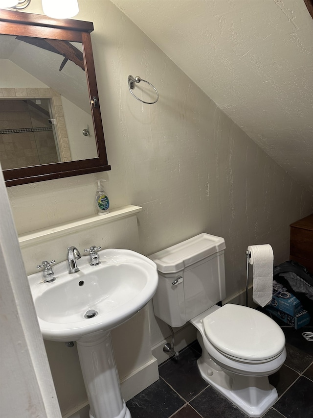 bathroom featuring tile patterned floors and toilet