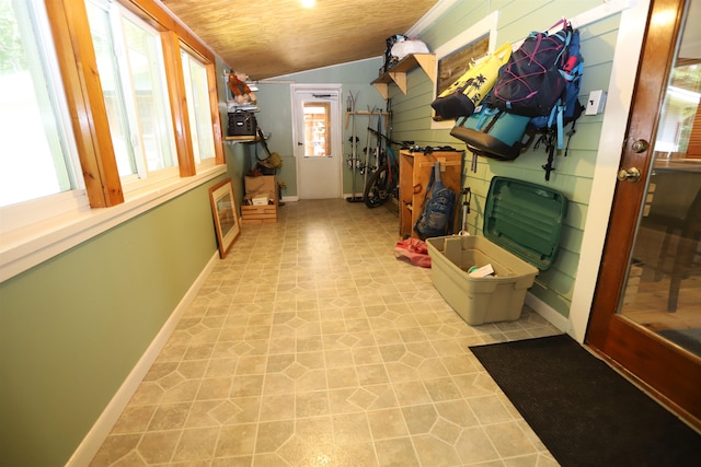 corridor with vaulted ceiling and wooden ceiling