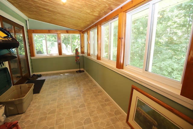 sunroom featuring plenty of natural light, wooden ceiling, and vaulted ceiling