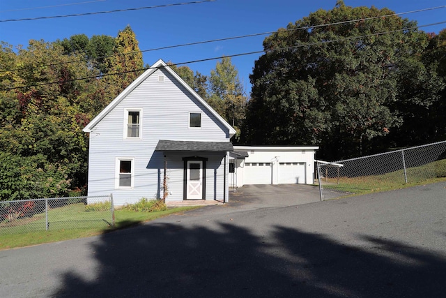 view of front property with a garage and a front yard