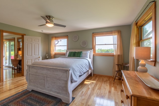 bedroom with ceiling fan and light hardwood / wood-style flooring