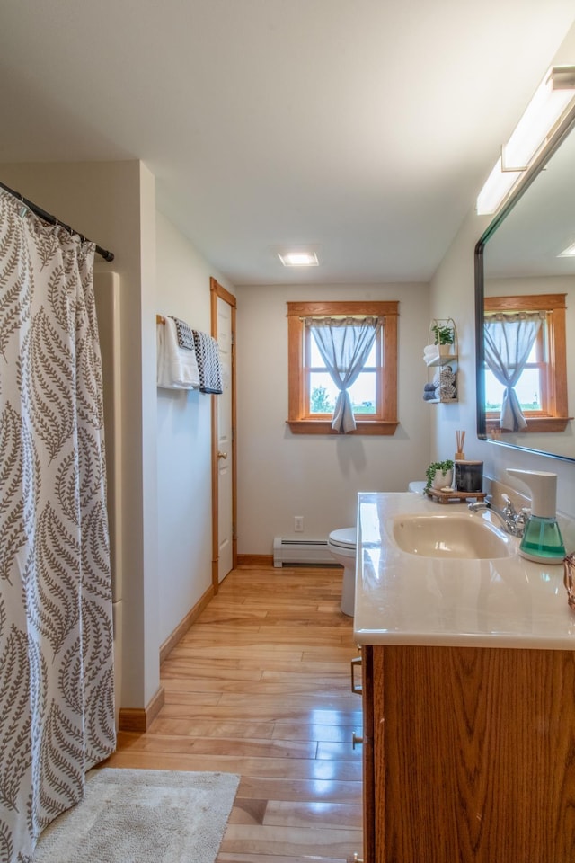 bathroom featuring toilet, a baseboard radiator, vanity, a shower with shower curtain, and hardwood / wood-style flooring