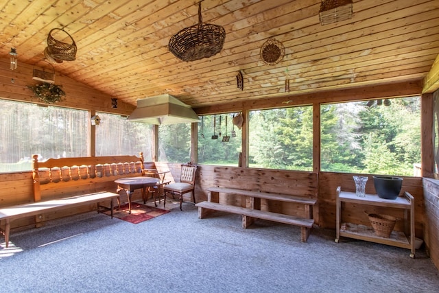 sunroom / solarium with lofted ceiling and wooden ceiling