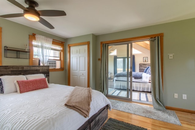 bedroom with wood-type flooring, access to outside, a closet, and ceiling fan