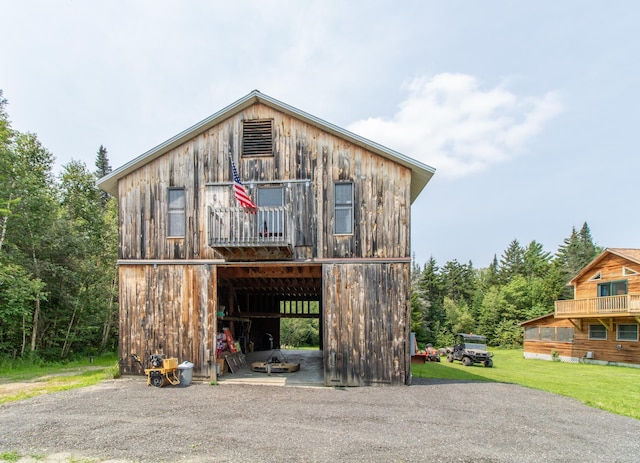 view of front of house with an outbuilding