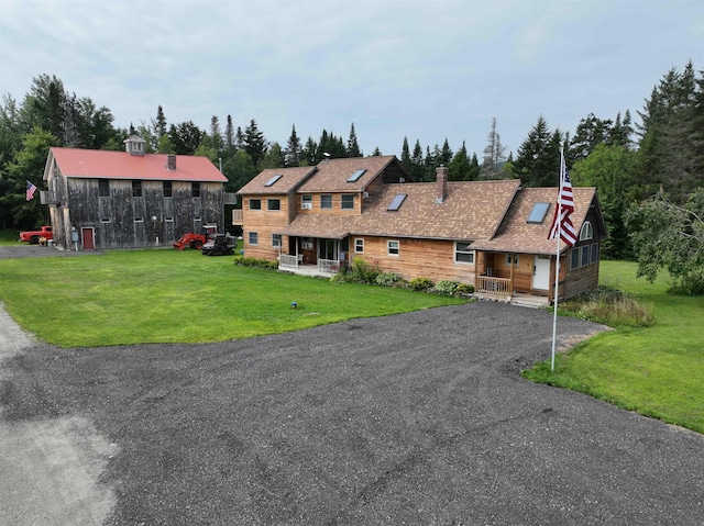 view of front of home featuring a porch and a front lawn